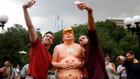 In pictures: Nude Donald Trump statues amuse crowds